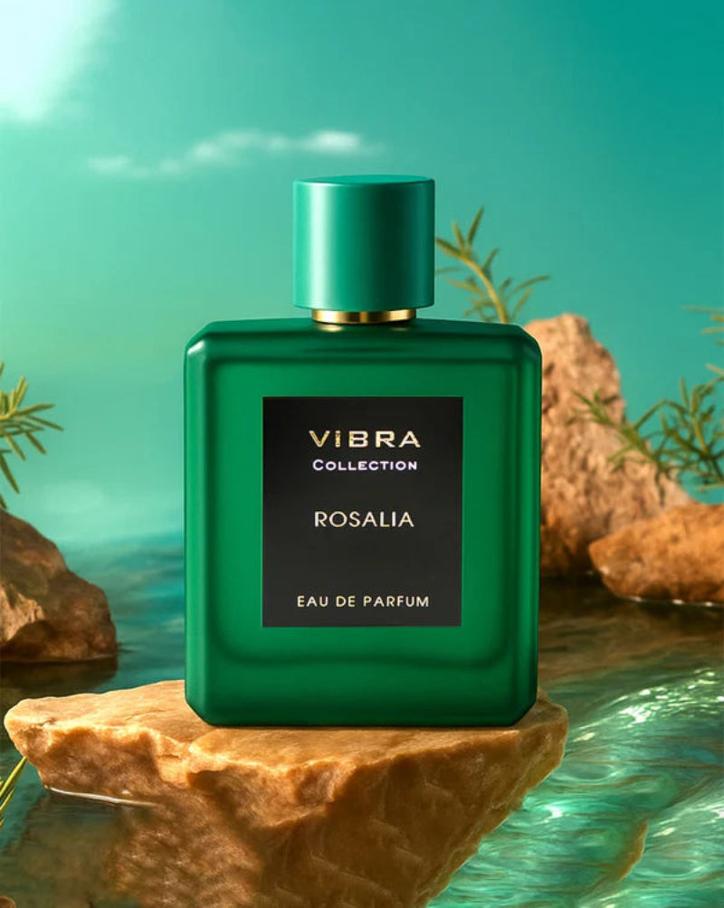 Green perfume bottle labeled 'Vibra Collection Rosalia' on a natural rock background