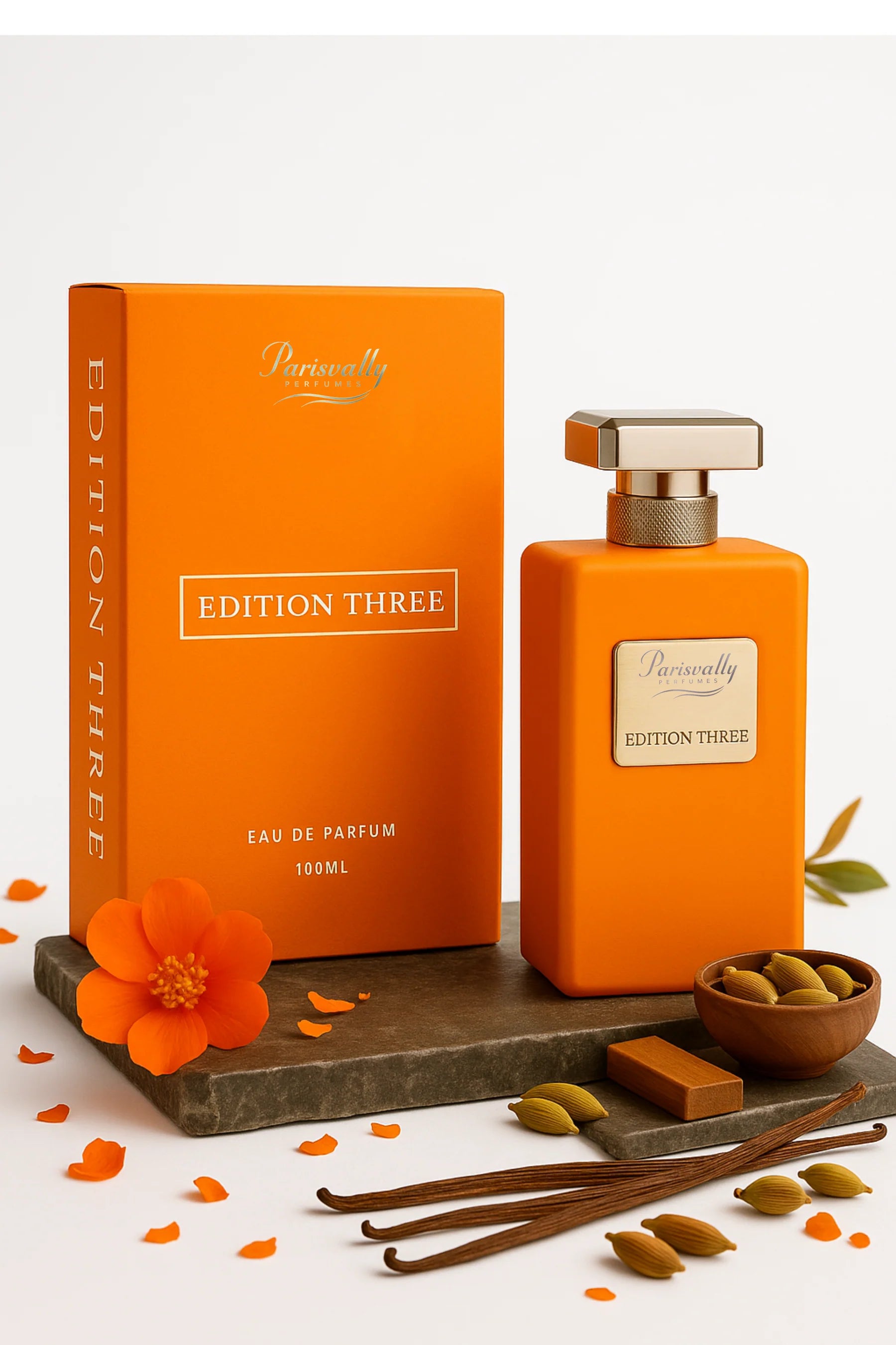 Orange perfume bottle and packaging with 'Edition Three' on a white background