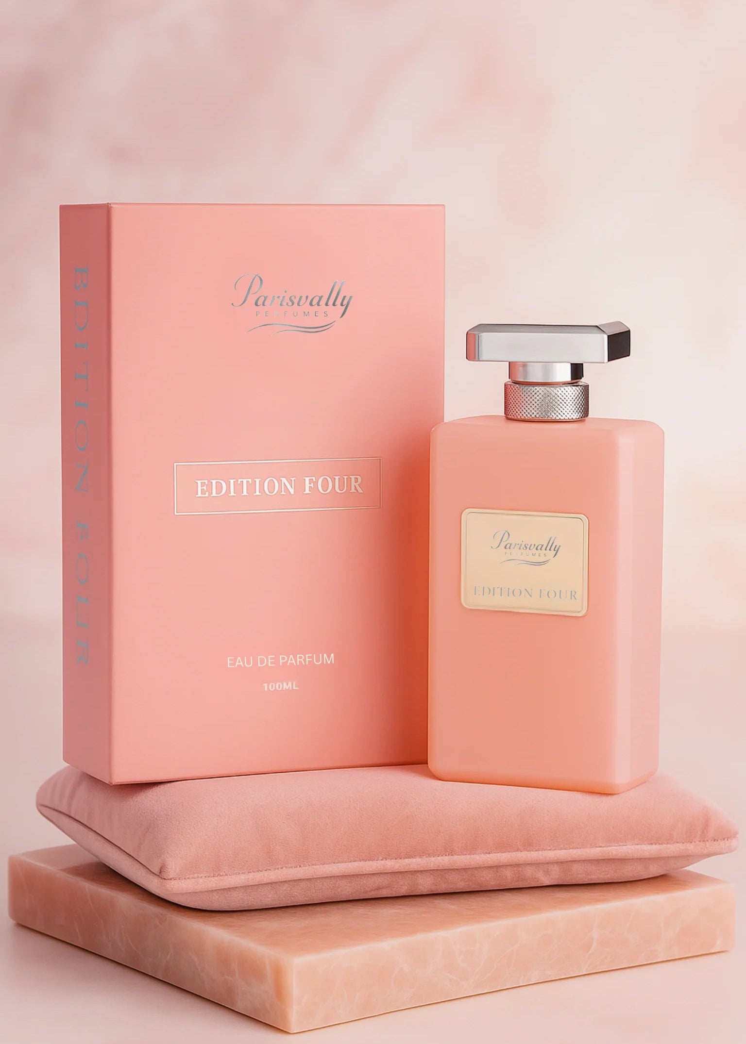 Pink perfume bottle and packaging on a matching pink background