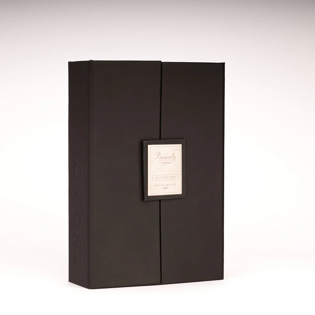 Black leather-bound album with a decorative label on a white background