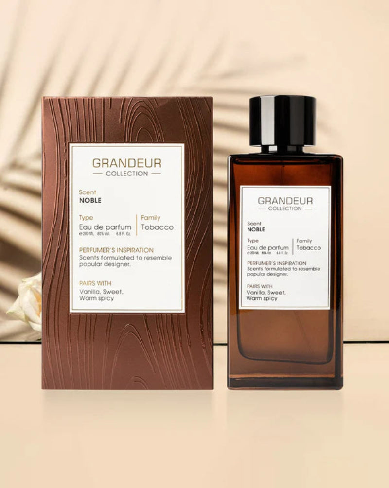 Grandeur Collection perfume bottle and packaging on a beige background