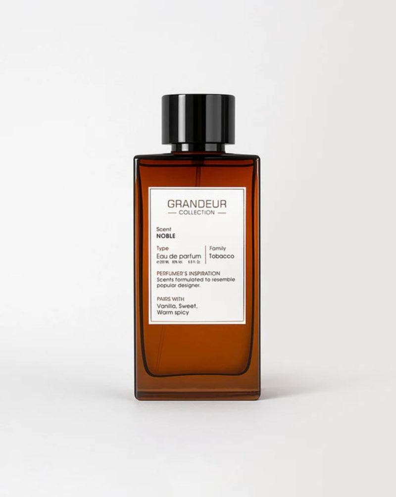 Brown perfume bottle with black cap on a white background