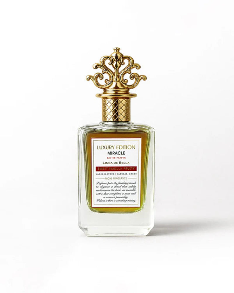 Luxury edition perfume bottle with gold cap on a white background